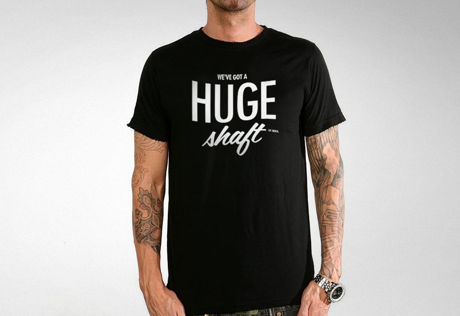 Speakeasy Liquors branded t-shirt demonstrating retail branding