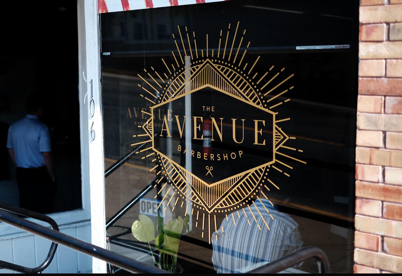 Avenue 618 barbershop logo vinyl barber shop and salon branding on window