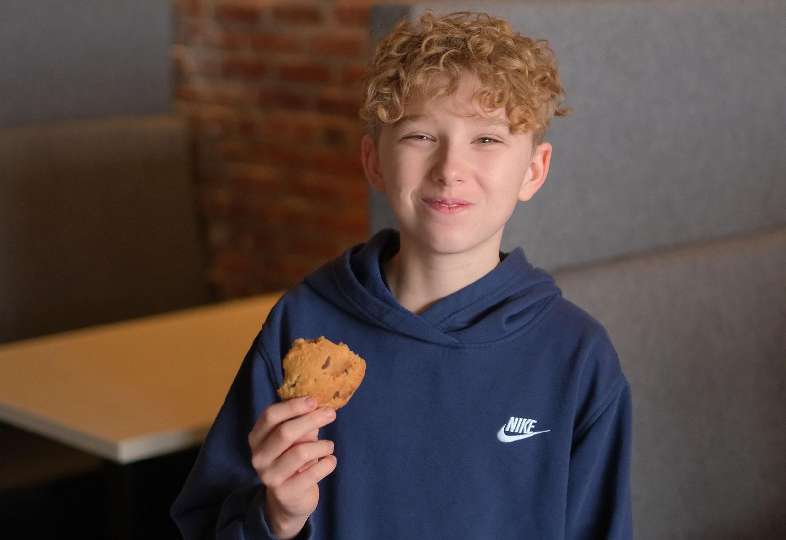 Seasoning Bistro child enjoying a cookie