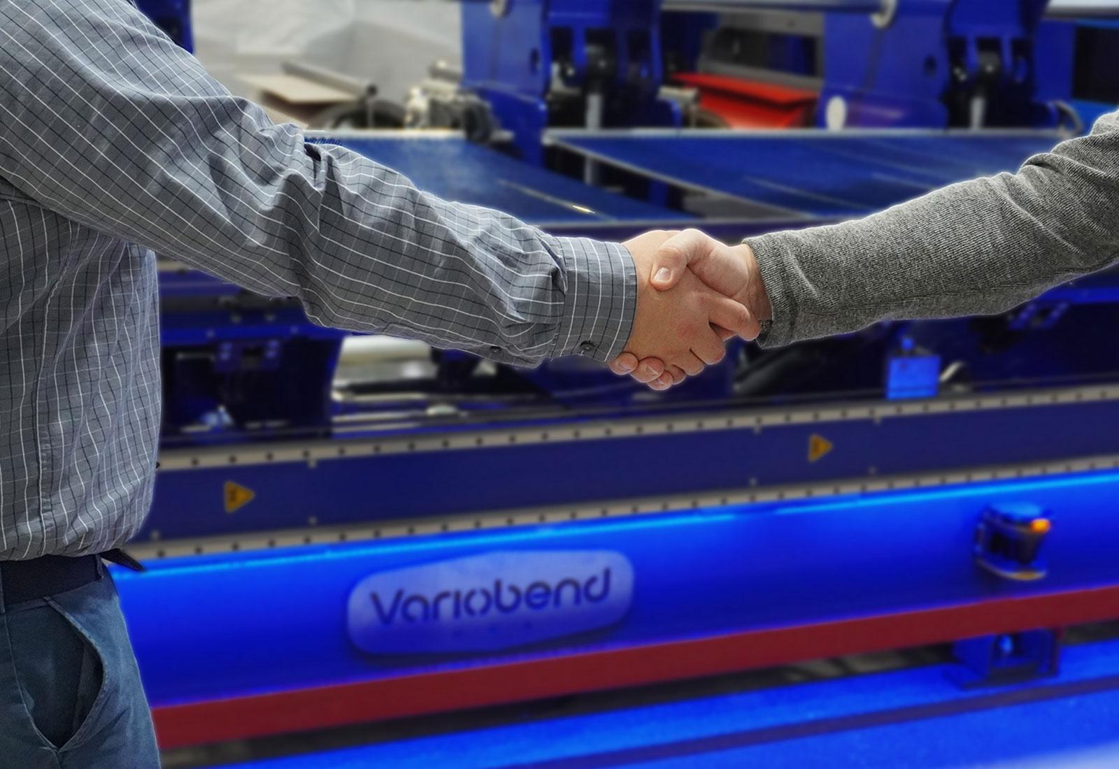 Variobend USA metal manufacturer branding handshake in factory