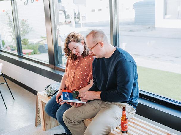 Michael Nolan and spouse reading Nelson & Winslow book
